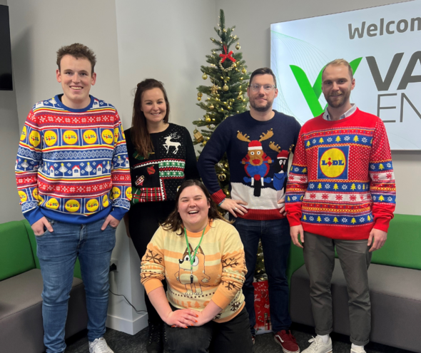 Staff wearing Christmas jumpers in the office